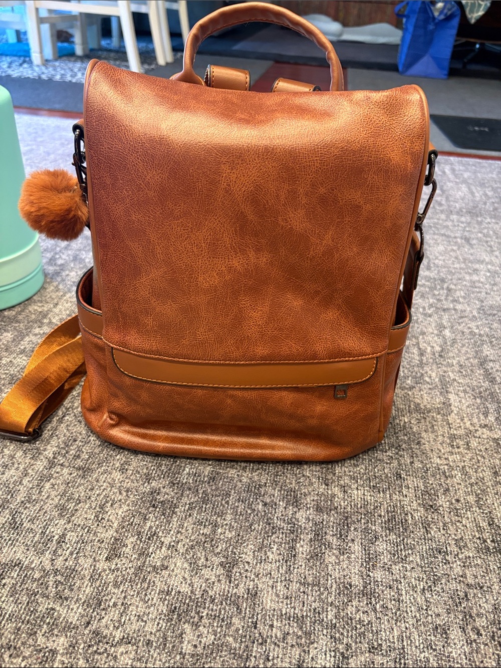Amazon Brown Faux Leather Backpack with Pom Pom Accent